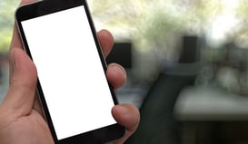 Closeup of Hand holding Blank Screen of Smart phone with blurred background as concept-1