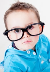 Little boy wearing big glasses - isolated over a white background